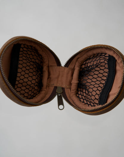 Inside of Mandrn leather rover circle pouch in color saddle