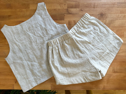 Flat lay of Kepola design house Naples linen crop tank And Delphi linen shorts in oyster