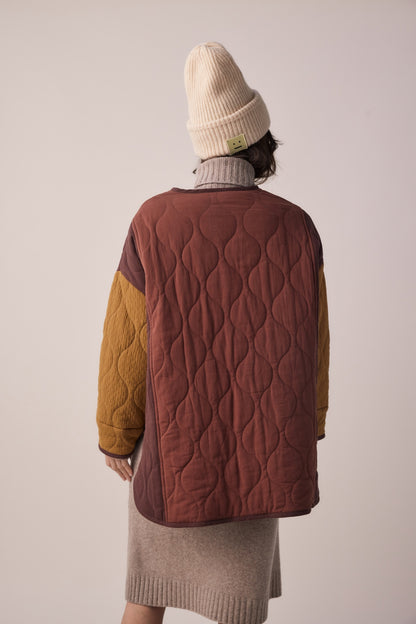 Back of Woman wearing amente cotton patch quilted jacket