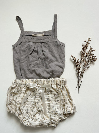 Tane Organics pointelle tank onesie in graphite Styled with floral bloomers