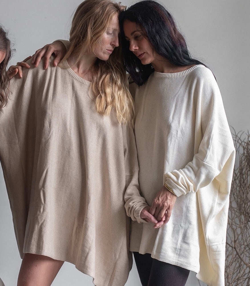 Two women wearing Avy & co Niamh knit sweaters in sand and cream